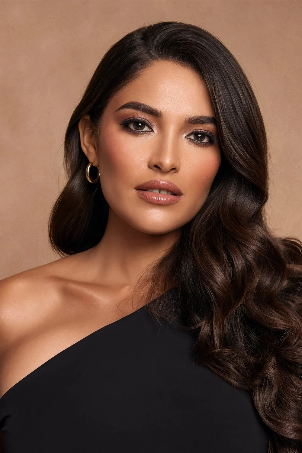 Evening peach soft glam with smoky copper-brown eyes, warm sculpted cheeks, and glossy nude lips